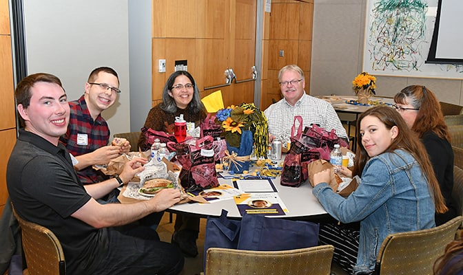 image of Susan Montgomery and guests at homecoming