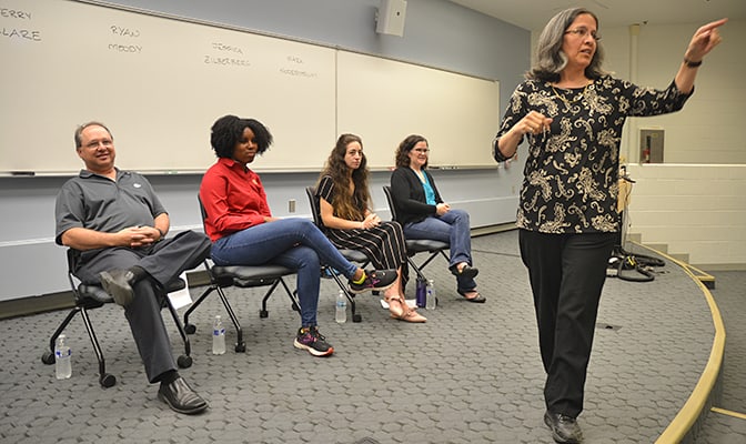 image of Susan Montgomery and alumni panelists in UG class