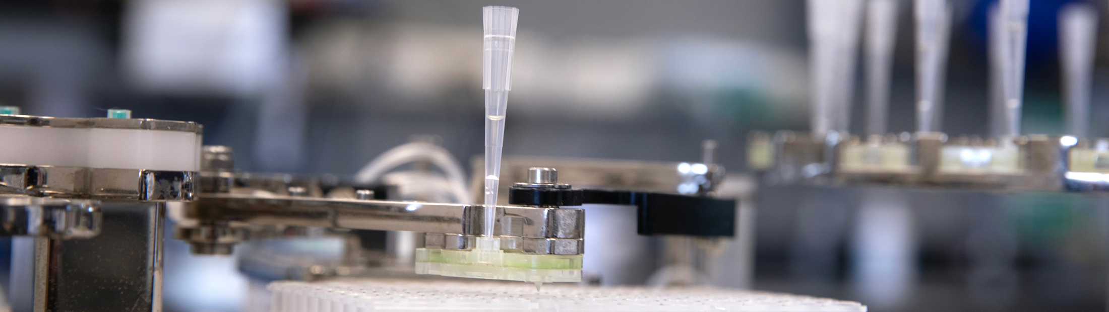 Lab equipment with liquid going into test tubes