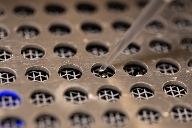 Droplet adding drops of water to a cooling unit designed to measure the temperature of water